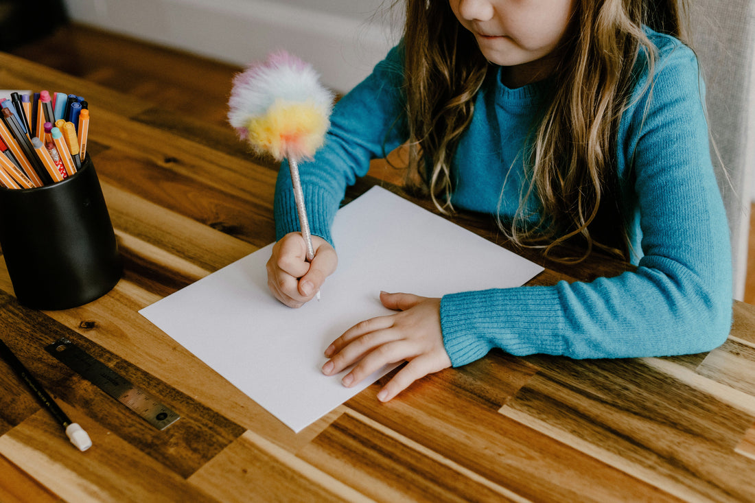 Child writing at bedtime to express emotions