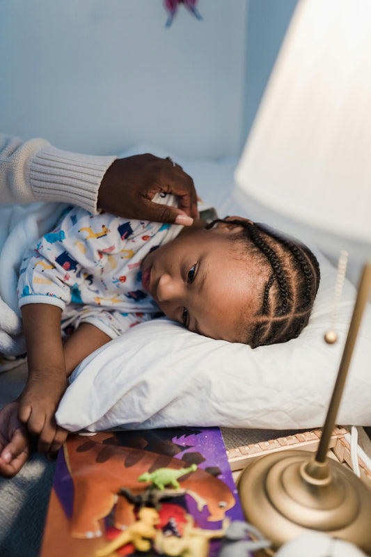 parent comforting child experiencing bedtime anxiety at night