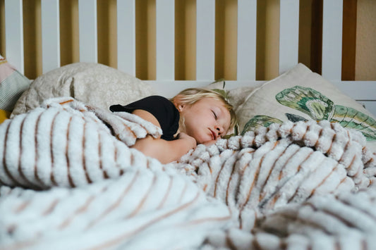 Child sleeping peacefully after overcoming fear of bad dreams