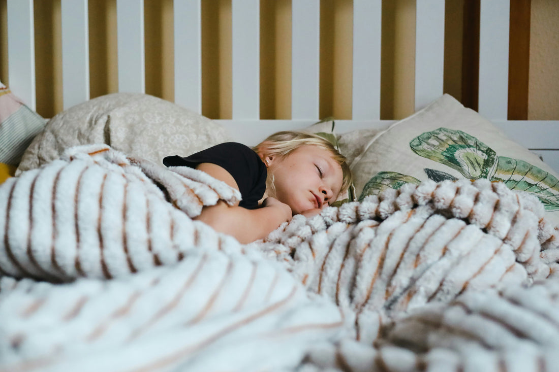 Child sleeping peacefully in bed